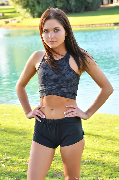 Zoe Bloom: Skinny Brunette Exercises Outdoors in Shorts by the Water – photo 19 of 20