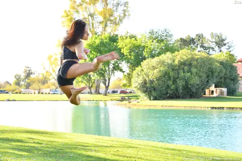 Zoe Bloom: Skinny Brunette Exercises Outdoors in Shorts by the Water – photo 6 of 20