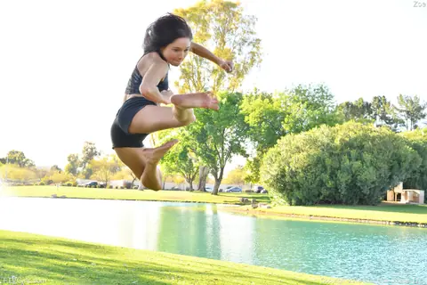 Zoe Bloom: Skinny Brunette Exercises Outdoors in Shorts by the Water – photo 7 of 20