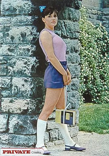 Busty Brunette in Socks and Uniform Spreads Outdoors