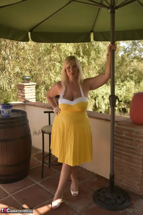 BBW Blonde Peels Off Her Dress on the Balcony – photo 1 of 16
