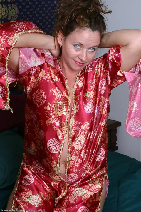 Thick MILF Strips and Masturbates with a Dildo – photo 2 of 20