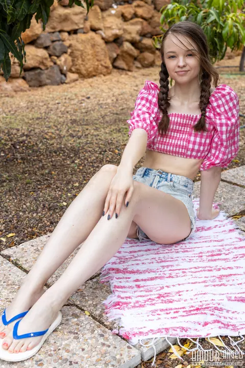 Woman in Pigtails Strips Off Her Shorts and Spreads on the Patio – photo 1 of 20