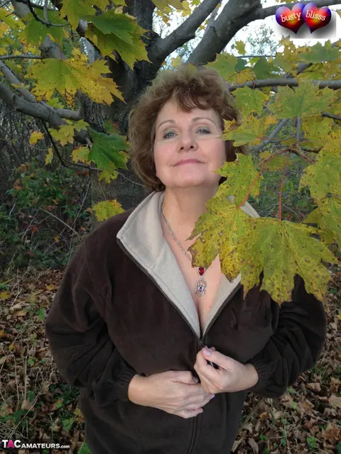 Bustybliss: Mature Curvy Brunette Undresses Outdoors Under a Tree – photo 1 of 20