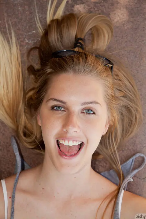 Holly Benson: Blonde in Glasses Poses Outdoors in Shorts and Bra – photo 8 of 11