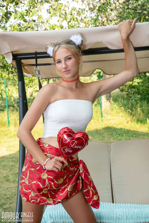 Blonde Strips Out of Her Panties and Spreads on a Bench Swing Outdoors – photo 1 of 20