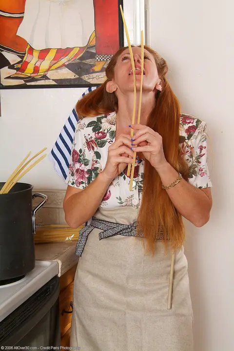 Thick Redhead MILF Strips Out of Her Skirt in the Kitchen – photo 2 of 20
