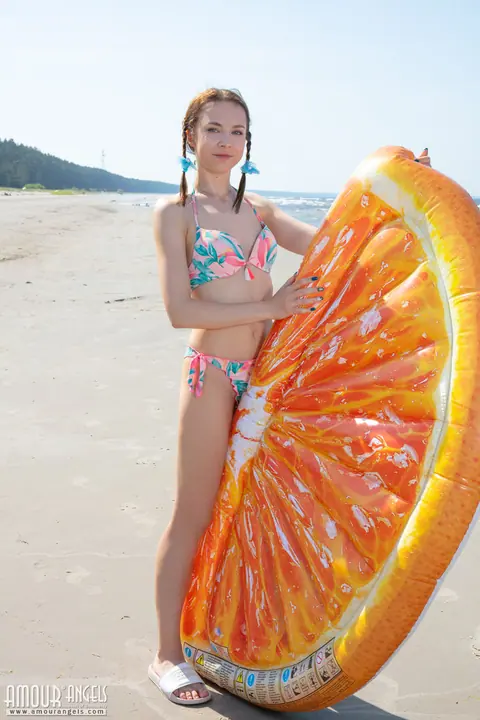 Slim Woman in Braided Pigtails Doffs Her Bikini on the Beach – photo 1 of 20