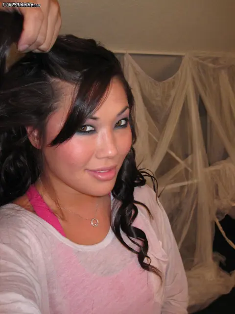 Kelly Madison: Busty Asian MILF Pulls Panties Aside in Lingerie – photo 8 of 16