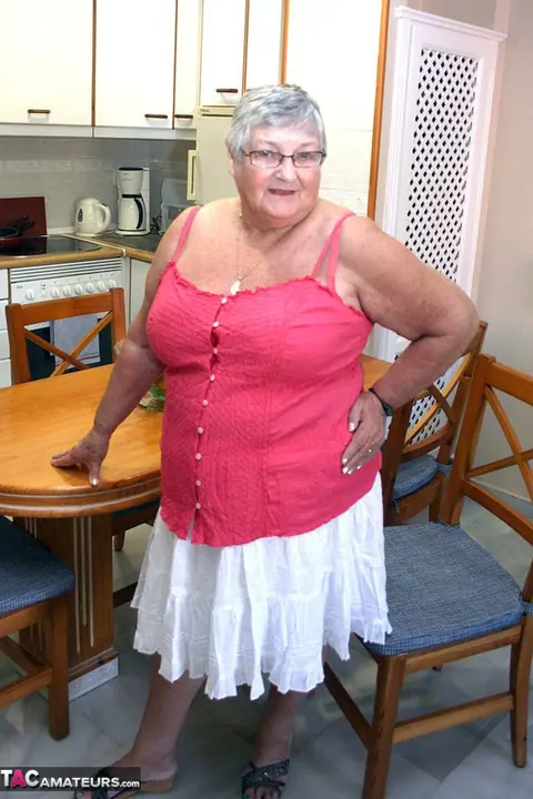 Busty British Brunette Bends Over in a Skirt to Show Her Curvy Figure – photo 1 of 20