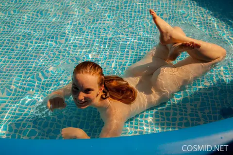Julia Fleming: Tall Curvy Redhead Frees Her Breasts by the Pool – photo 15 of 16