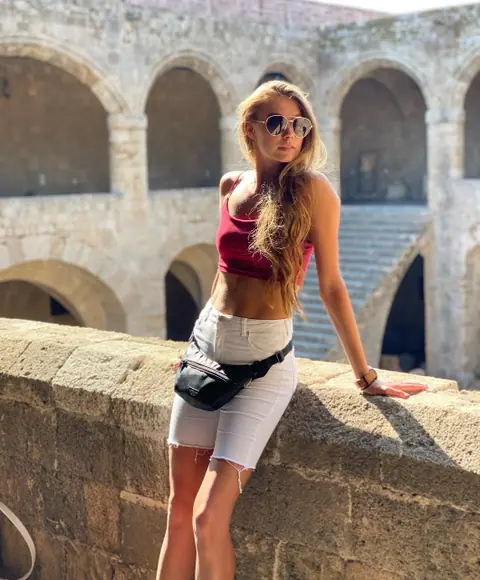 Slim Woman Poses in a Bikini on the Beach After Removing Dress – photo 8 of 20