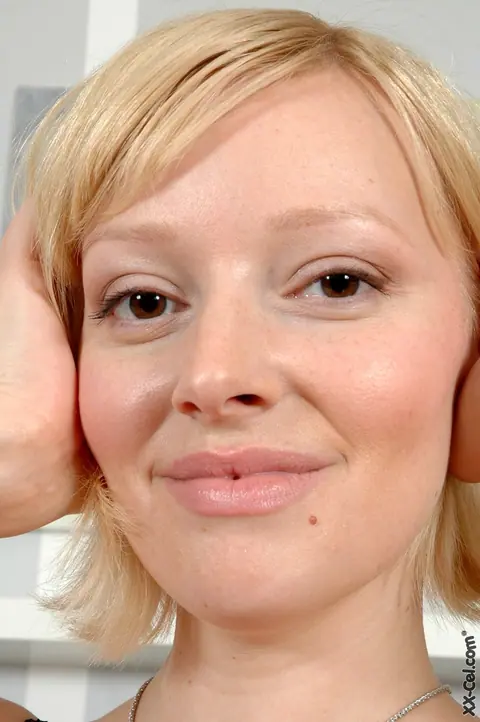 Sophie Mei: Blonde in Stockings Strips to Show Her Huge Natural Tits – photo 3 of 20