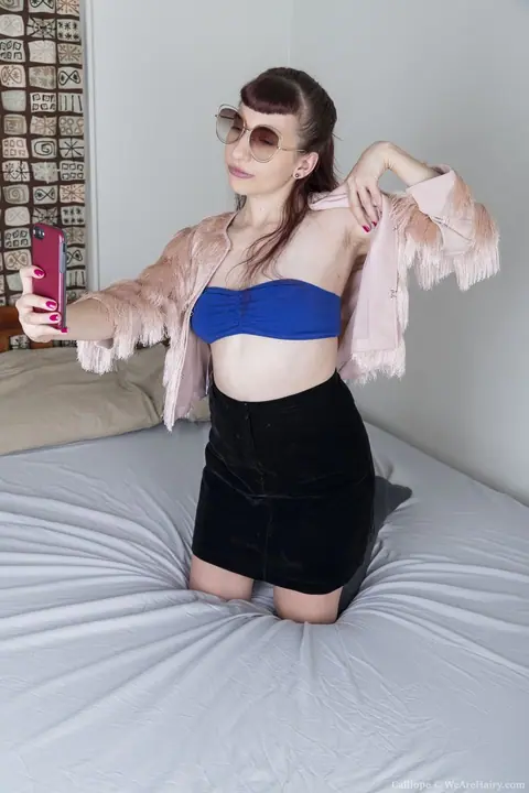 Woman in a Skirt Pulls Panties Aside and Fingers Herself – photo 2 of 20