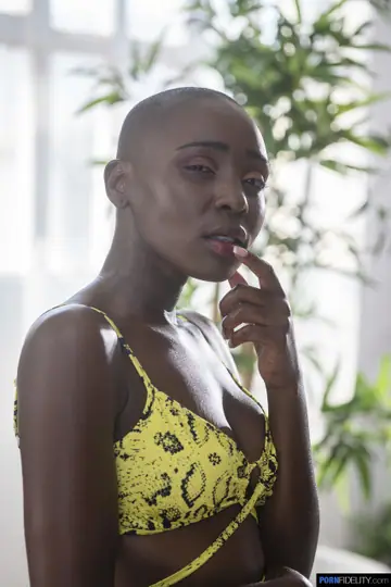 Zaawaadi – Slim Ebony Woman Unveils Shaved Pussy in Group Outdoors