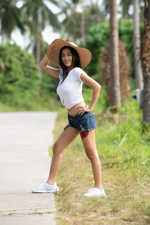 Busty Asian Babe in a Bikini Oils Her Hairy Bush Outdoors – photo 1 of 20