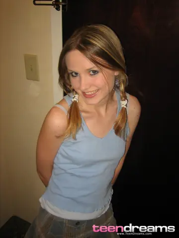 Slim Blonde Strips Out of Her Thong Behind a Hotel Door